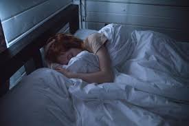 Article cover for 'How to Improve Your Sleep' with a person sleeping in a bed. - proBLENopathy