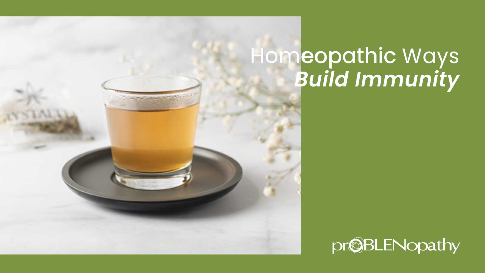Article cover for '10 Homeopathic Ways to Build Immunity' with a cup of tea in a glass cup on a white table. - proBLENopathy